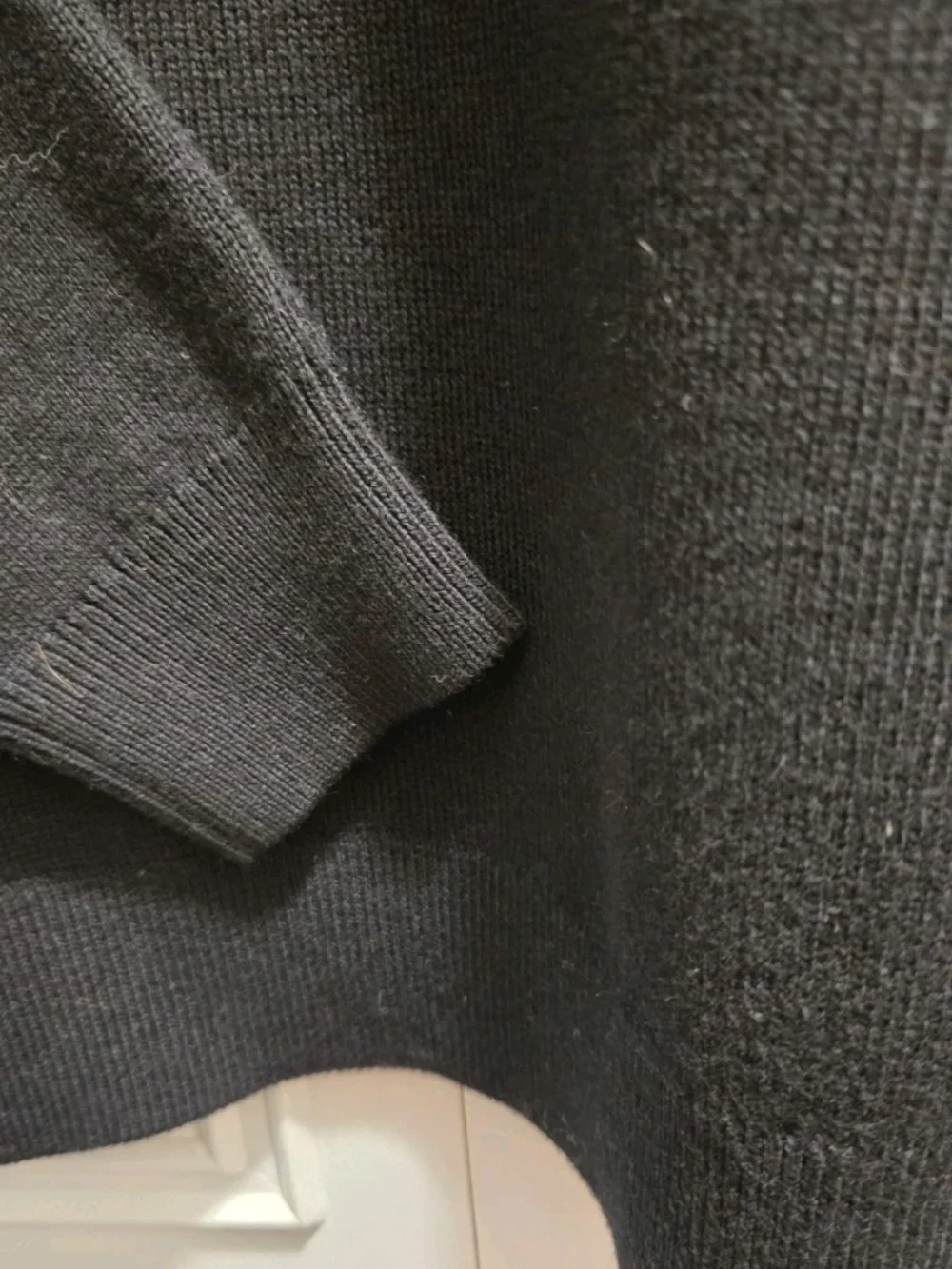 CHANEL Uniform Black Crewneck Sweater with Gold CC Sunburst